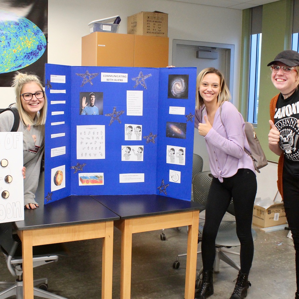 Victoria presents a poster on communicating with aliens using sign language