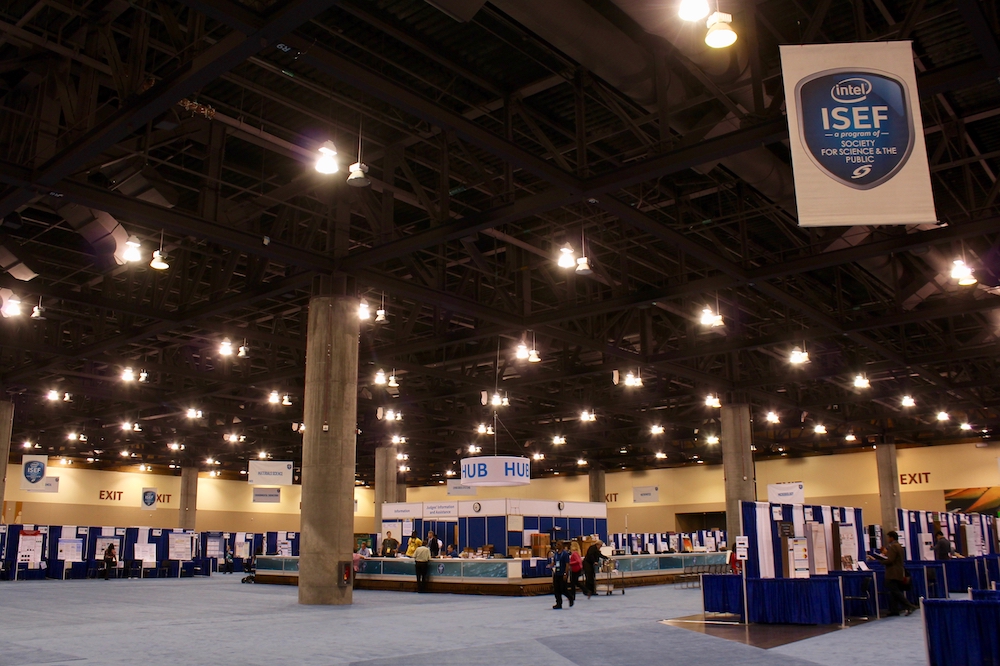 A view of the grand hall for the Intel International Science and Engineering Fair in 2019, with student posterboards set up in multiple rows