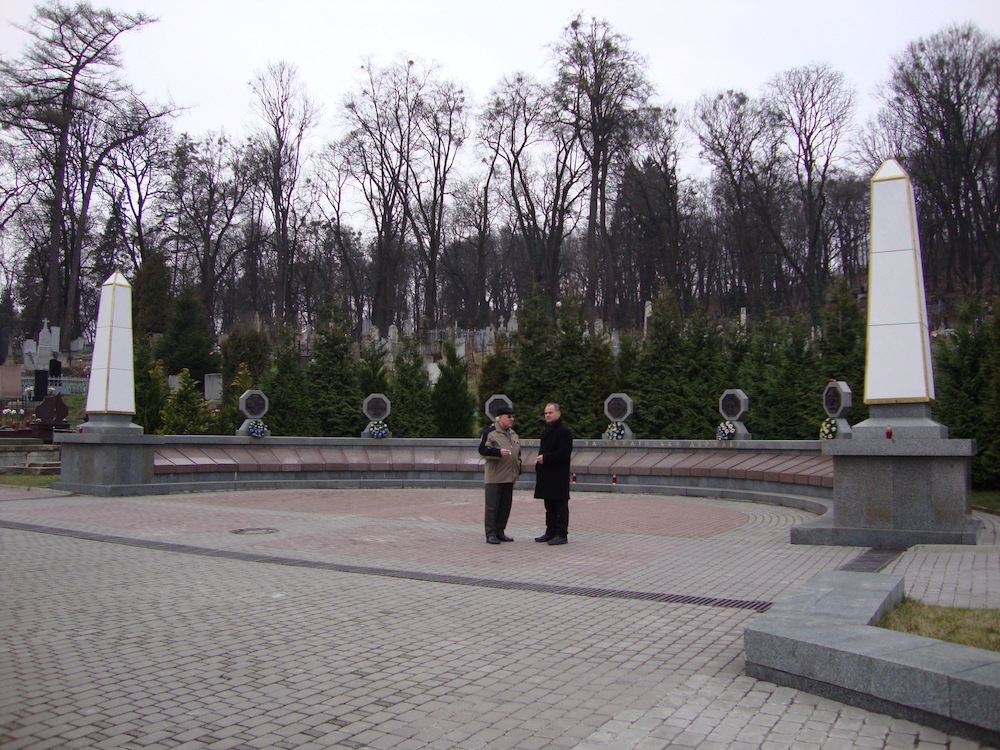 Volodimir and a friend chatting at the Lychakiv Cemetery in Lviv, Ukraine